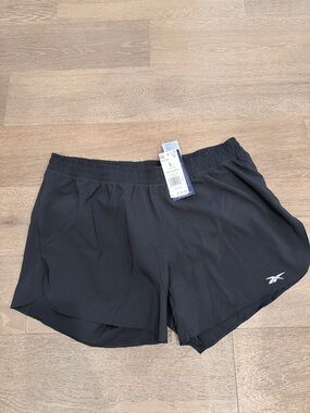 Women’s Black Reebok running shorts. Size:Large. NWT.